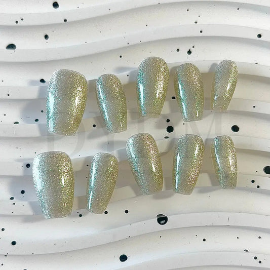 Lunar Radiance handmade press on nails showcases a silver cat eye effect that captures the essence of moonlit beauty.